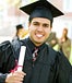 Male holding college diploma
