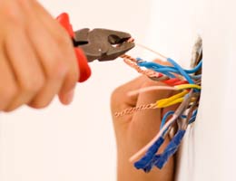 hidden-insurance-credits-3-wiring-lg Electrician working on wiring
