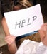 Holding sign for help