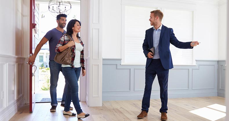 More homebuyers hit the streets while mortgage rates fall Homebuyers entering new home with agent | monkeybusinessimages/Getty Images