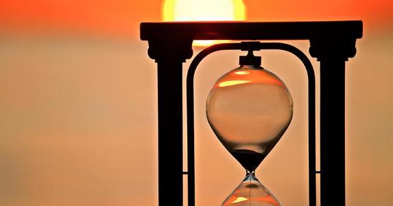 After 7 years, clock stops ticking on debt Hourglass and sunset background | iStock.com/Leslie Achtymichuk