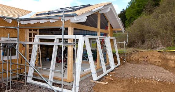 1st-time buyer programs exist for prefab houses Foundation of new house being constructed | Westend61/Getty Images