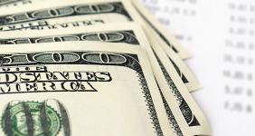 Hundred dollar bills and bank statement balance © sergign/Shutterstock.com
