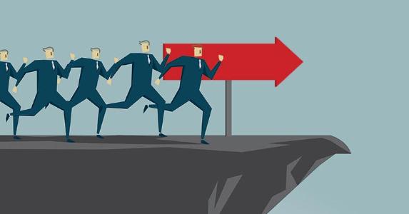 5 stupid tax mistakes Illustration of businessmen running off of a cliff | erhui1979/DigitalVision Vectors/Getty Images