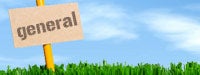 a brown sign reading "general" in grass with a blue sky background 