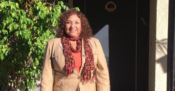 A California woman's reverse mortgage loan success story Lisa Mayo standing outside her home | Photo courtesy of Lisa Mayo