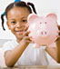 Little girl with piggy bank