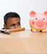 Man with hammer and piggy bank