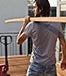 Man holding plywood renovation ©Ilya Shapovalov/Shutterstock.com
