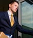 man in suit quitting leaving building