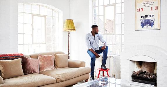 Tax effects on the unemployed: some help, some hurt Man leaning against windowsill | Kelvin Murray/Getty Images