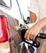 man refueling SUV