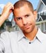 man scratching head houses