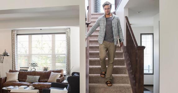 Backing out of contract with 'ugly house' agent Man with book going down the stairs | Hero Images/Getty Images