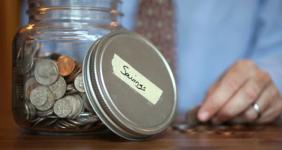 Man with a savings jar