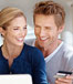 Man and woman making purchase online