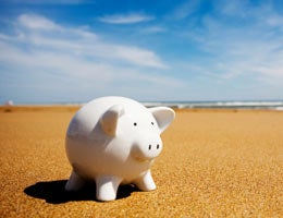 A piggy bank on the beach