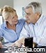 mature couple concerned calculating bills