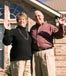 mature couple house waving