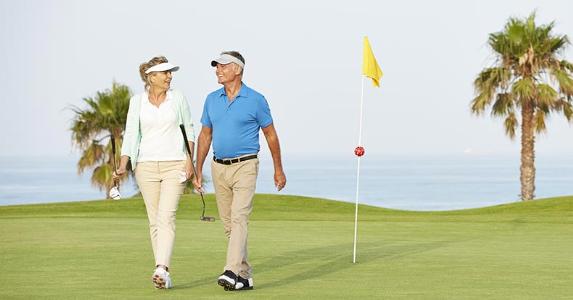 Can we pay tax on RMDs later, or must we pay sooner? Mature couple playing golf | Chris Ryan/Getty Images