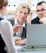 mature couple speaking with advisor