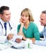 mature couple speaking with doctor