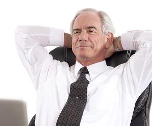 Mature, relaxed businessman reclining on chair with hands behind his neck © Straight 8 Photography/Shutterstock.com