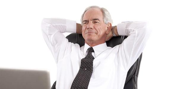 Mature, relaxed businessman reclining on chair with hands behind his neck © Straight 8 Photography/Shutterstock.com