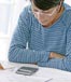 mature woman reviewing calculations