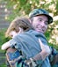 Military man hugging his son