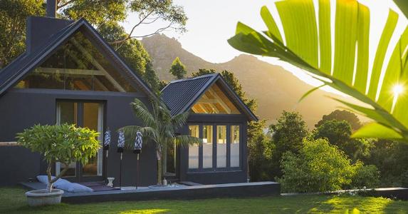 Modern house on hill in tropical location | Portra Images/DigitalVision/Getty Images