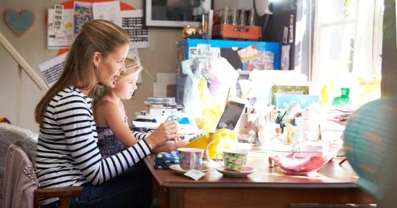 Earned income tax credit: Complex, but worth it Mom with young daughter sitting on lap, using laptop computer | Monkey Business Images/Shutterstock.com