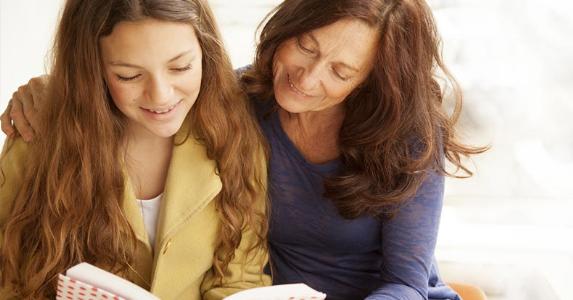 Owing tax on an inherited Series EE Savings bond Mother and daughter reading a book | Brainsil/E+/Getty Images