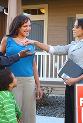 New homeowners outside receiving keys © Morgan Lane Photography / Shutterstock.com