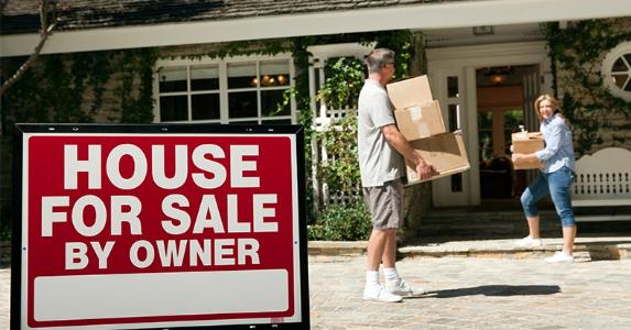 FHA tweaks mortgage rule for student loans Couple moving into new home | Image Source/Getty Images