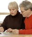older couple reviewing paperwork