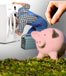 piggy bank and a man repairing a dryer