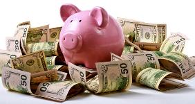 Piggy bank on 50 dollar bills © sheff/Shutterstock.com