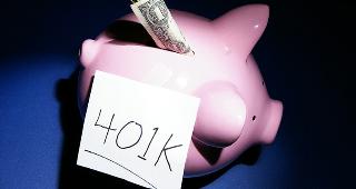Piggy bank with dollar and 401k © zimmytws/Shutterstock.com