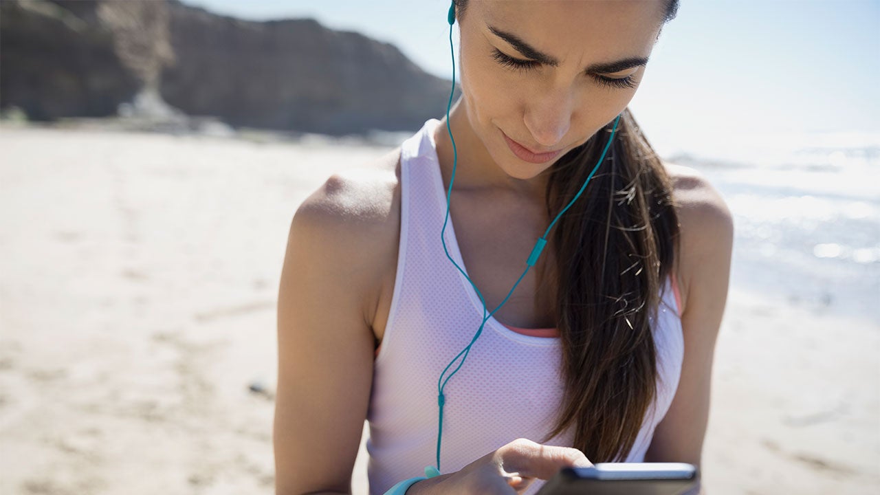 Protect yourself with a fraud alert on your credit report Jogger checking her phone | Hero Images/Getty Images