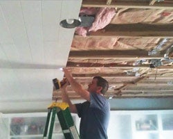 John Melton installing ceiling planks