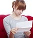 sad woman on red couch