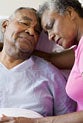 Senior couple embracing in hospital