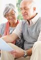 Senior couple reviewing document © Yuri Arcurs - Fotolia.com