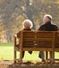 Senior couple sitting on bench in the park