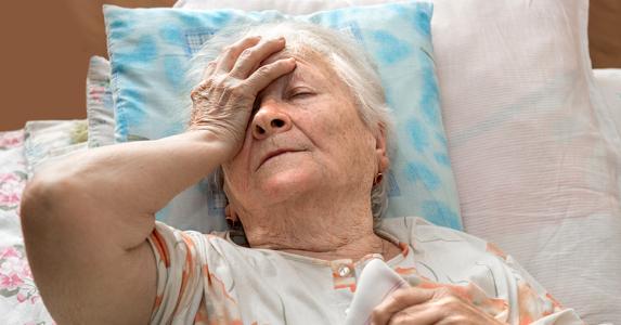 Senior woman laying in bed © Volodymyr Baleha/Shutterstock.com