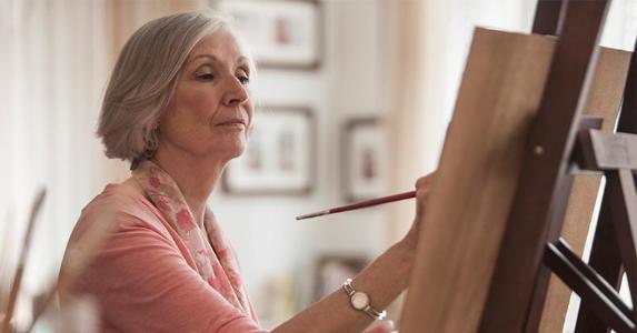 Bankruptcy halts reverse mortgage payments Senior woman painting at home | Jose Luis Pelaez Inc/Getty Images