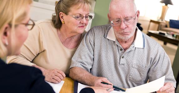 Seniors explain: Why we got a reverse mortgage Seniors looking over document in kitchen © Andy Dean Photography/Shutterstock.com