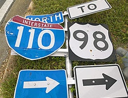Dodge damaged road signs © spirit of america/Shutterstock.com