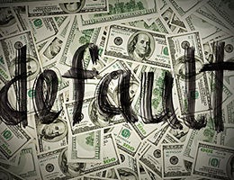 I made payments on time, but I'm in default © HamsterMan/Shutterstock.com